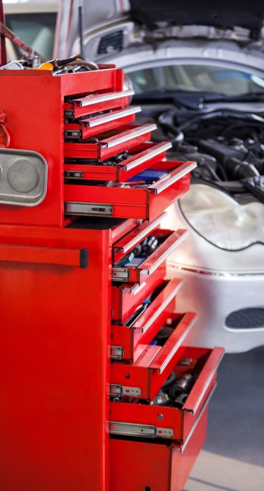 Set of work tools in toolbox at repair garage